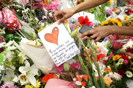 Flowers and messages are places on the steps of the Kilbirnie Mosque on March 17, 2019 in Wellington, New Zealand. 50 people are confirmed dead and 36 are injured still in hospital following shooting attacks on two mosques in Christchurch on Friday, March 15. The attack is the worst mass shooting in New Zealand's history.
