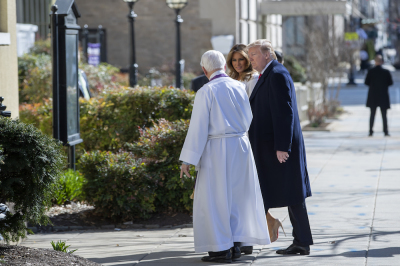 U.S. President Donald J. Trump (R) and first lady Melania Trump (C) are greeted by Reverend W. Bruce McPherson (L) as they arrive to attend services at St. John's Episcopal Church March 17, 2019 in Washington, DC, USA. The Trumps are attending church on St. Patrick's Day.