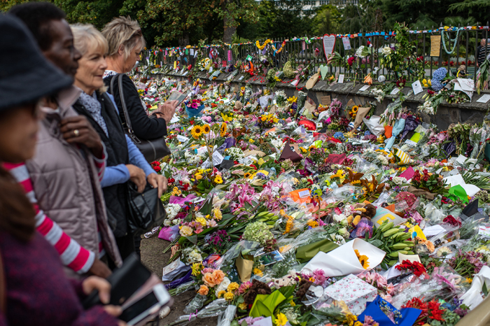 People view flowers and tributes placed by the botanical gardens in Christchurch, New Zealand, March 19, 2019. Fifty people were killed, and dozens are still injured in hospital after a gunman opened fire on two Christchurch mosques on March 15. The attack is the worst mass shooting in New Zealand's history. 