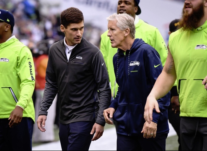 Ben Malcolmson (L) walks with Seattle Seahawks (R) head coach Pete Carroll.