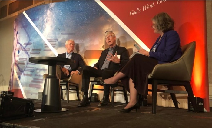 National Institutes of Health Director Francis Collins speaks during the BioLogos Conference 2019 in Baltimore, Maryland, on March 27, 2019. He is flanked by BioLogos President Deborah Haarsma (R) and California megachurch pastor John Ortberg (L).