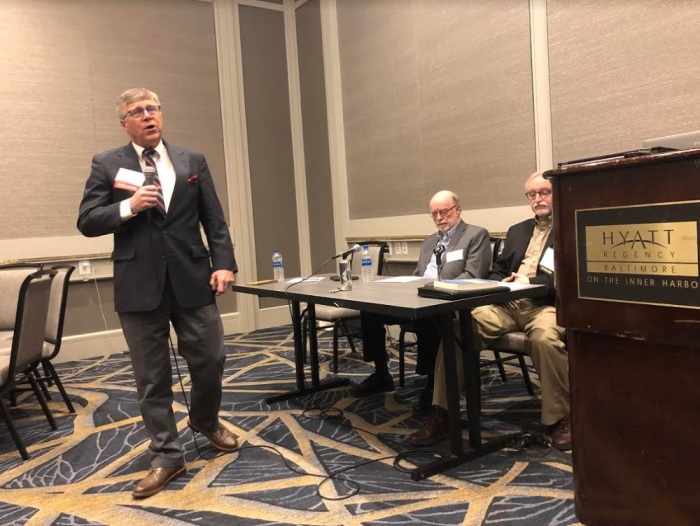 Wheaton College professor Stephen Moshier (L) speaks during the BioLogos 19 Conference in Baltimore, Maryland, on March 28, 2019. He is joined during a breakout discussion by colleagues John Walton (R) and Larry Funck (M). 