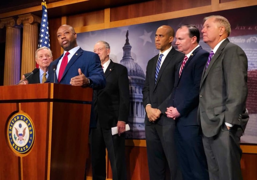 Republican South Carolina Sen. Tim Scott (podium) discusses the First Step Act with other legislators in December 2018.