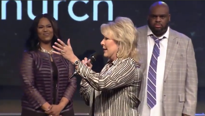 Pastor Hope Carpenter (foreground) defends Pastors John and Aventer Gray at Relentless Church in Greenville, S.C., on March 31, 2019.