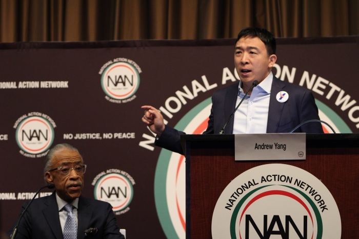 Andrew Yang, businessman and 2020 Democrat presidential candidate pitches his argument for Universal Basic Income at the National Action Network convention in New York City on Wednesday April 3, 2019. NAN founder and civil rights activist, the Rev. Al Sharpton listens with the audience.