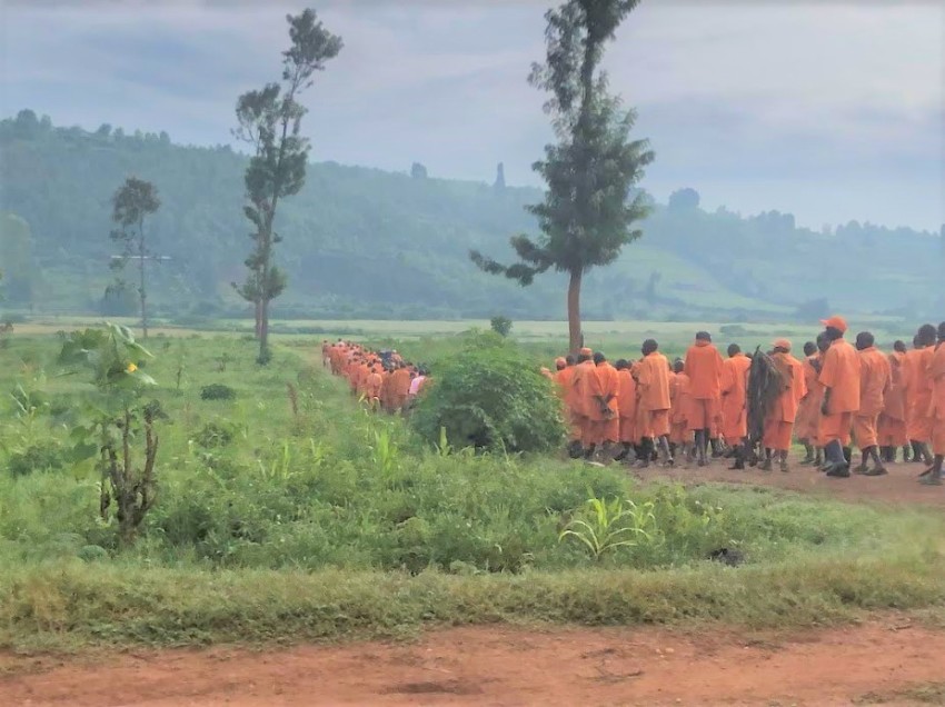 Prisoners prepare for manual labor in the fields of the Southern Province of Rwanda.