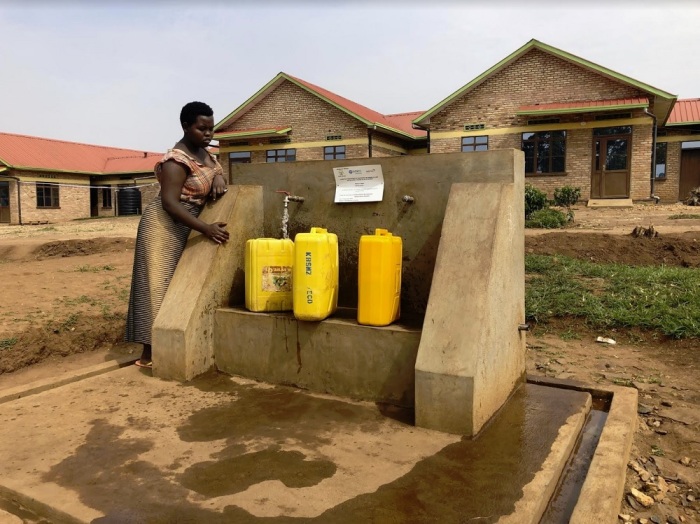 A villager fills up her jerry cans with water using a water pipeline installed in the village of Kabusanza in Rwanda's Southern Province. The nearly 5-mile pipeline was installed by the evangelical humanitarian aid agency World Vision. 