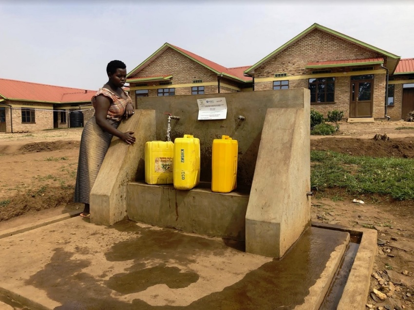 A villager fills up her jerry cans with water using a water pipeline installed in the village of Kabusanza in Rwanda's Southern Province. The nearly 5-mile pipeline was installed by the evangelical humanitarian aid agency World Vision.