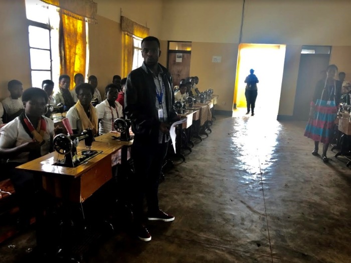 Coordinator Jean Bosco gives a tour of the Youth Friendly Center in the Nyamasheke district in Rwanda's Western Province in February 2019. Pictured are kids being trained to be tailors. 