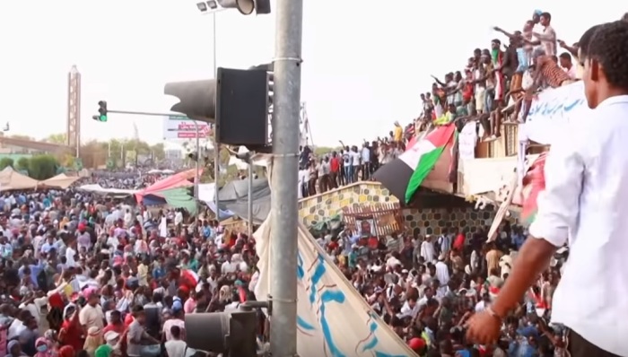 Protesters in Sudan in April 2019 amid the overthrow of longtime president Omar al-Bashir, who has been accused of engaging in war crimes in the Darfur region. 