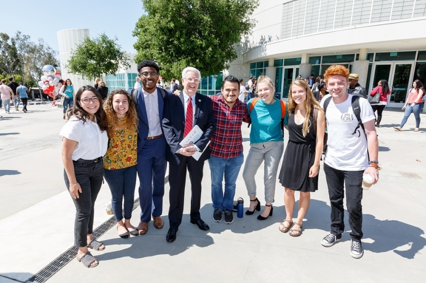 Incoming Azusa Pacific University President Paul Ferguson poses with students on the school's Southern California campus.