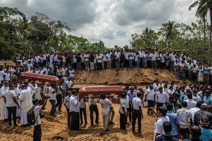 Coffins are carried to a grave during a mass funeral at St Sebastian Church on April 23, 2019, in Negombo, Sri Lanka. At least 320 people were killed with hundreds more injured after coordinated attacks on Easter Sunday rocked three churches and three luxury hotels in Sri Lanka. 