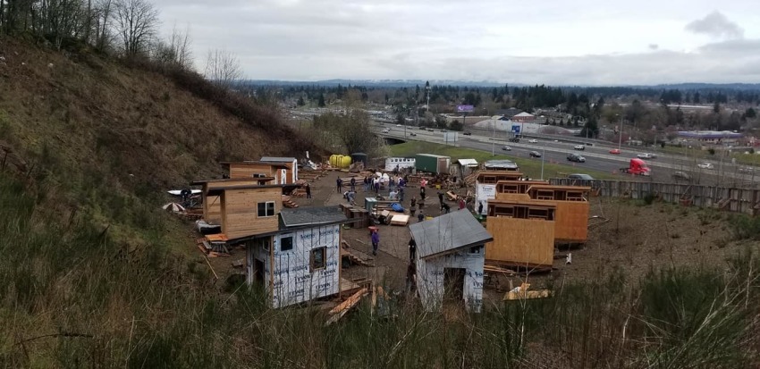 Volunteers work to construct Agape Village on the 11-acre campus of the Central Church of the Nazarene in Portland, Oregon in March 2019.