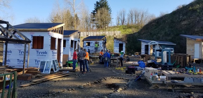 Volunteers work to construct Agape Village on the 11-acre campus of the Central Church of the Nazarene in Portland, Oregon in March 2019.