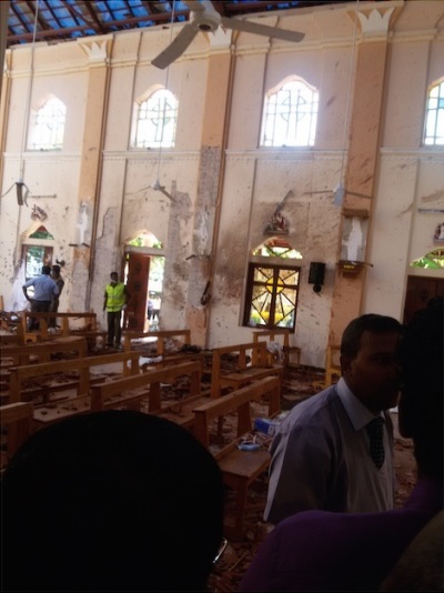 Believers congregate inside St. Sebastian Church in Katuwapitiya, Sri Lanka after the Easter bombing suicide attack on April 21, 2019. 