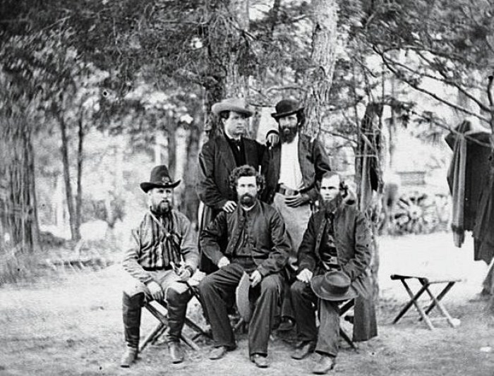 Harrison's Landing, Va. Group of the Irish Brigade. Photograph from the main eastern theater of war, the Peninsular Campaign, May-August 1862. Sitting from left to right: Captain Clooney, Eighty-eighth New York, Father Dillon, Chaplain of the Sixty-third New York, and Father Corby, Chaplain of the Eighty-eighth New York. Standing from left to right: Visiting priest and Colonel Patrick Kelly, Eighty-eighth New York.