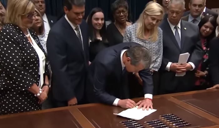 Georgia Gov. Brian Kemp signs HB 481, also known as The Living Infants Fairness and Equality Act, into law on May 7, 2019.