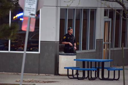 A police officer stands watch at the scene of a shooting in which at least seven students were injured at the STEM School Highlands Ranch on May 7, 2019 in Highlands Ranch, Colorado.