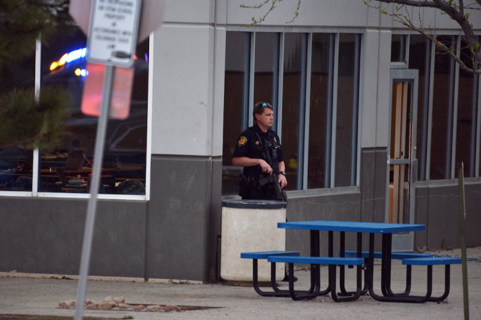 A police officer stands watch at the scene of a shooting in which at least seven students were injured at the STEM School Highlands Ranch on May 7, 2019 in Highlands Ranch, Colorado. 
