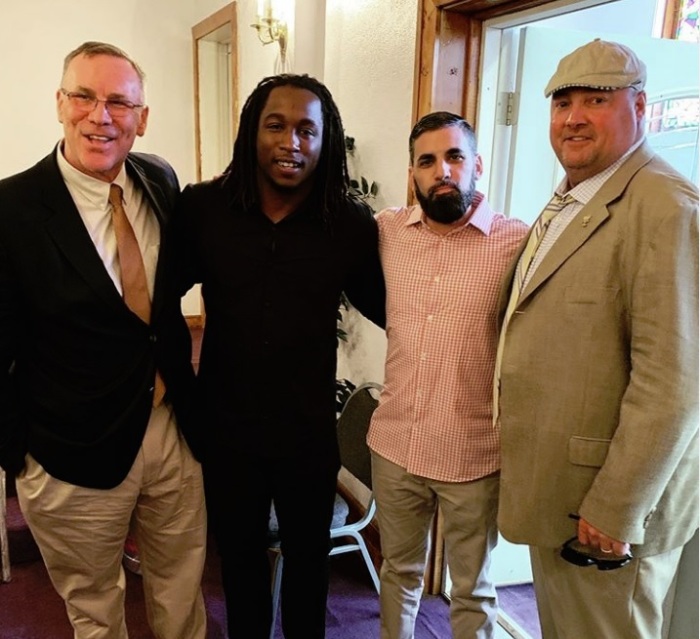 Kareem Hunt (middle-left) poses for a photo with Browns head coach Freddie Kitchens (right), Browns General Manager John Dorsey (left) and his agent, Dan Saffron (middle-right) at True Vince Baptist Church in Cleveland, Ohio on May 19, 2019. 