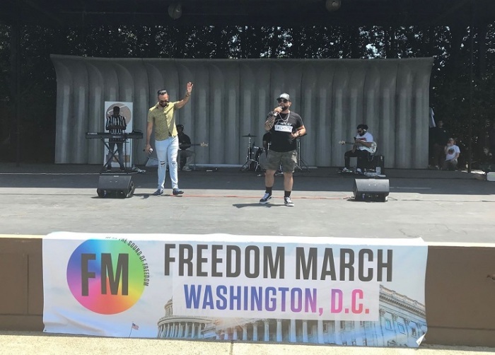 Pulse nightclub shooting survivors Angel Colon (L) and Luiz Javier Ruiz (R) speak at the Freedom March at the Sylvan Theater in Washington, D.C. on May 25, 2019. 