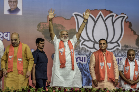 India Prime Minister Narendra Modi waves to the supporters from the public rally on May 26, 2019, in Ahmedabad, India.