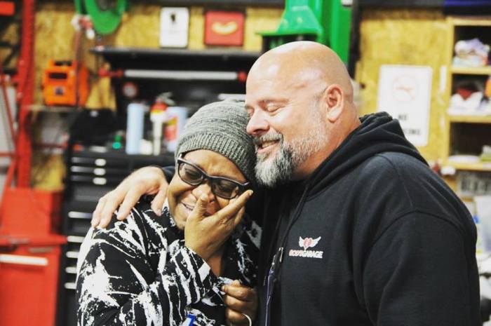 God's Garage founder PC “Pastor Chris” Williams, provides a shoulder to a grateful recipient of the group's work.
