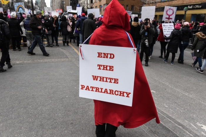 A woman wears a red robe from A Handmaid's Tale while participating in the Women's March on January 19, 2019 in New York City. 