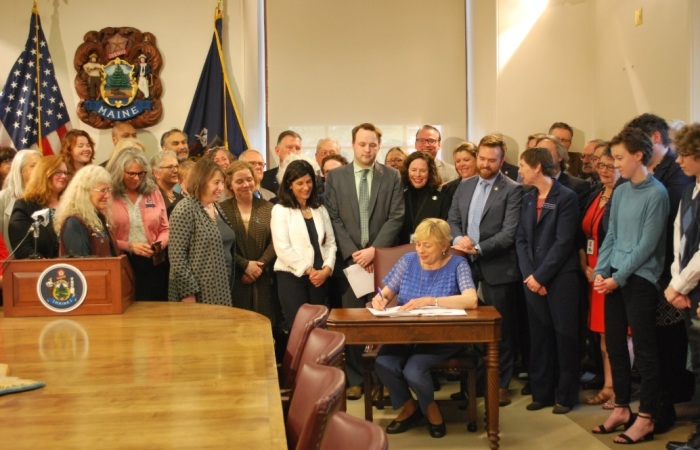 Maine Governor Janet Mills signing a bill into law that bans sexual orientation conversion therapy for minors on Wednesday, May 29, 2019. 