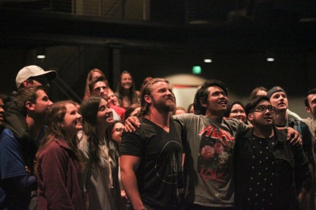 Young adults participate in worship at Elevate Young Adult Ministry in Collin County, Texas.