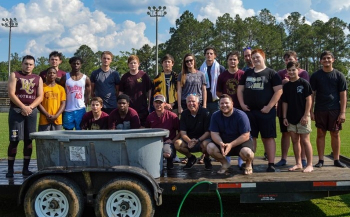 A photo from an event in which members of the Washington County High School football team were baptized, with some claiming that it was a violation of the separation of church and state. 