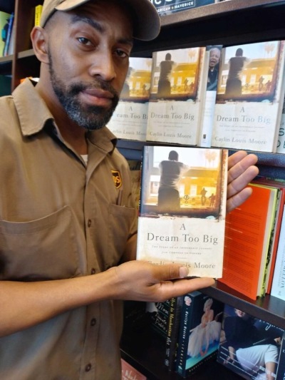 LaMarr Moore, Caylin’s uncle, holds Caylin’s book at Barnes & Noble, 2019.