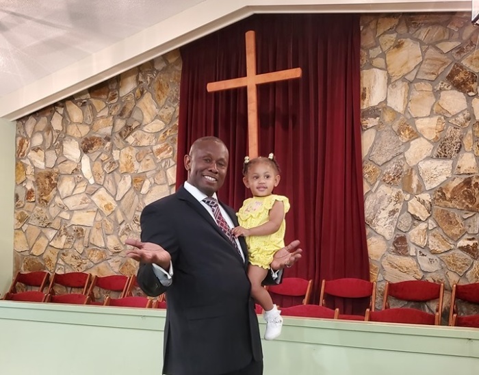 The Rev. Tony Lowden pictured here with his daughter Tabitha, is the first black pastor of Maranatha Baptist Church in Plains, Ga., where former President Jimmy Carter and his wife Rosalynn are longtime members.