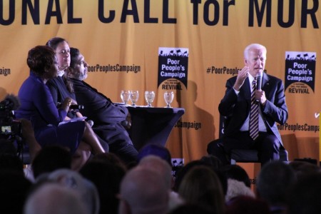 Former vice president and 2020 presidential hopeful Joe Biden (R) speaks at the Poor People's Campaign presidential forum at Trinity Washington University in Washington, D.C. on June 17, 2019. Situated to his right on the state are Rev. William Barber, Rev. Liz Theoharis and MSNBC host Joy Reid.