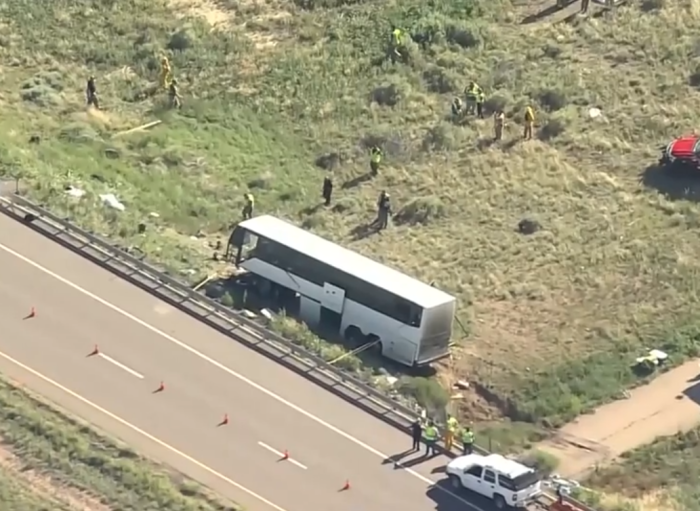 First responders on the scene after a church charter bus carrying 10 adults and five children crashed in Pueblo, Colorado, Sunday, June 23, 2019.