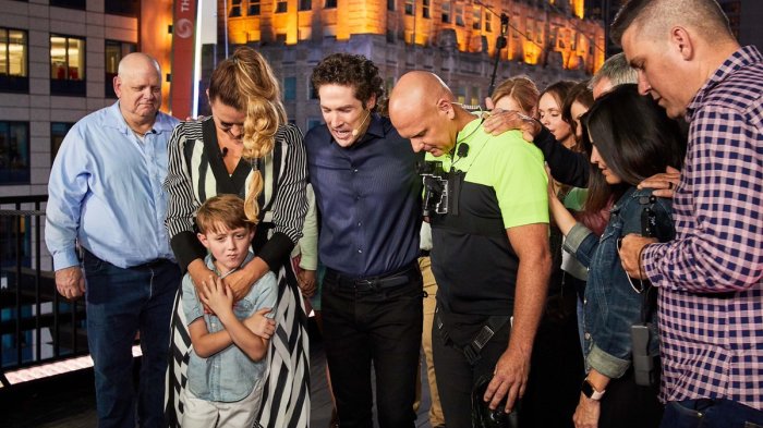 Televangelist Joel Osteen prays with Christian daredevil Nik Wallenda and his sister Lijana ahead of their historic tightrope walk in New York City's Times Square on Sunday June 23, 2019.