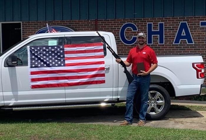 Chatom Ford dealership’s general sales manager Koby Palmer, 29, is giving away free guns, Bibles and American flags with the purchase of a vehicle.