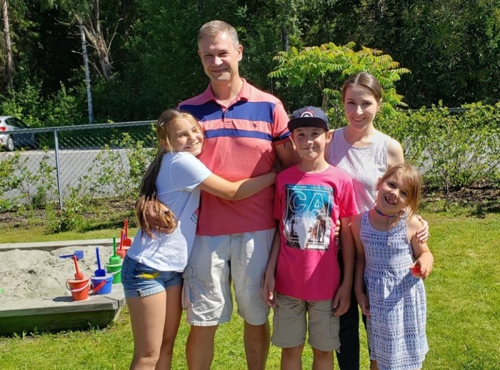 Natalya Shutakova and Zigintas Aleksandravicius pose for a photo with their three children during a June 2019 supervised meeting in Norway.