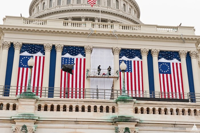 The 'Betsy Ross' design displayed at the second inauguration of Barack Obama. Workers hang historic US flags at the US Capitol building for the 2012 Presidential Election, January 4, 2012.