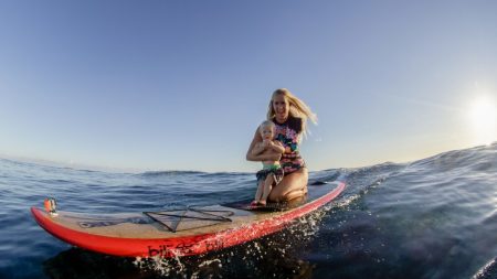 Bethany Hamilton and her son appear in the film "Bethany Hamilton: Unstoppable," July 2019.