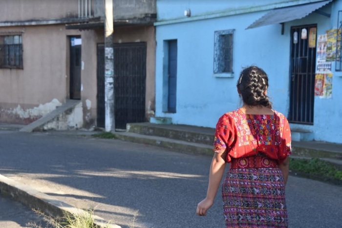International Justice Mission-aided sexual assault survivor 'Belinda' walks on a street in Guatemala City, Guatemala.
