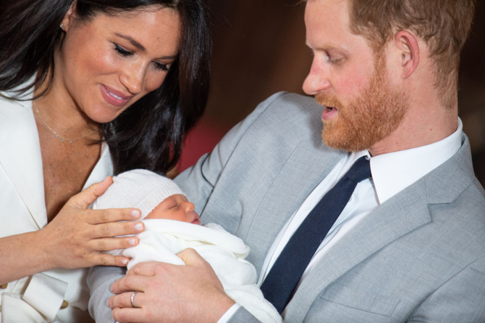 Prince Harry, Duke of Sussex and Meghan, Duchess of Sussex, pose with their newborn son Archie Harrison Mountbatten-Windsor during a photocall in St. George's Hall at Windsor Castle on May 8, 2019 in Windsor, England. The Duchess of Sussex gave birth at 05:26 on Monday 06 May, 2019. 