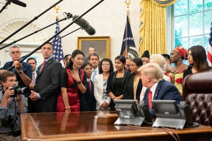 President Donald Trump listens to the experiences of Tibetan Buddhist Nyima Lhamo at the White House in Washington, D.C. during a meeting with 27 survivors of religious persecution on July 18, 2019. 