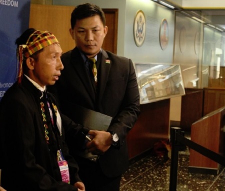 Pastor Langjaw Gam Seng (L) speaks with reporters during the U.S. State Department's Ministerial to Advance Religious Freedom at the Harry S. Truman Building in Washington, D.C., on July 17, 2019.