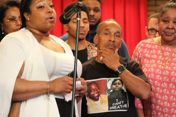 Emerald Garner speaks at the fifth anniversary of her father's death at Canaan Baptist Church in Harlem, New York, on July 30, 2019. She is joined by her brothers, Emery and Eric Garner Jr.; her mother, Esaw Snipes Garner (not pictured); Korey Wise, one of the exonerated Central Park Five; Ilyasah Shabazz (back left), daughter of Malcolm X, and actor, rapper, dancer Sean “ARNSTAR” Kirkland (back center).