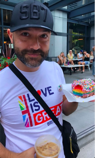 Former pastor and author Joshua Harris marches in the Vancouver Pride Parade on August 4, 2019.