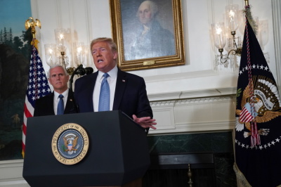 U.S. President Donald Trump makes remarks on the mass shootings in El Paso, Texas, and Dayton, Ohio, over the weekend in the Diplomatic Reception Room of the White House as U.S. Vice President Mike Pence looks on, August 5, 2019 in Washington, DC.