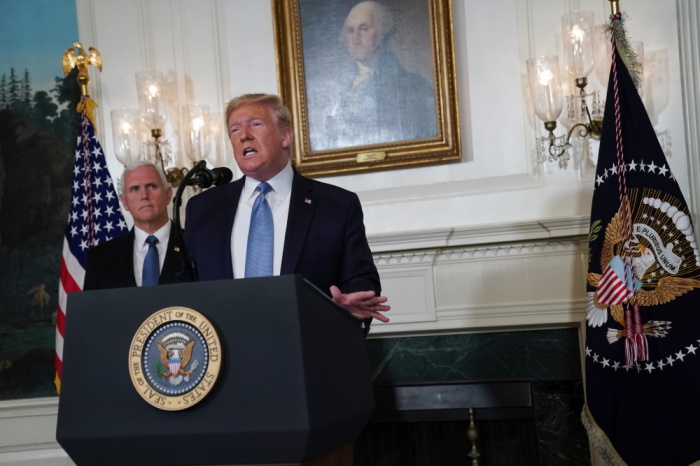 U.S. President Donald Trump in the Diplomatic Reception Room of the White House as U.S. Vice President Mike Pence looks on, August 5, 2019, in Washington, DC.