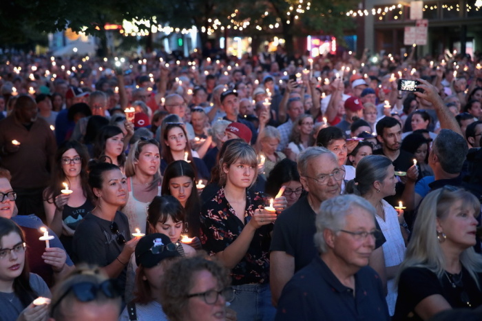 Mourners attend a memorial service in the Oregon District to recognize the victims of an early-morning mass shooting in the popular nightspot on August 04, 2019 in Dayton, Ohio. At least 9 people were reported to have been killed and another 27 injured when a gunman identified as 24-year-old Connor Betts opened fire.
