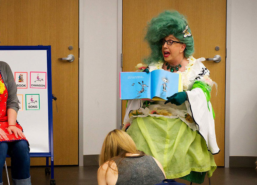 "Miss Kitty Litter" reading to children at a "Drag Queen Story Hour" in the Austin Public Library in Austin, Texas.